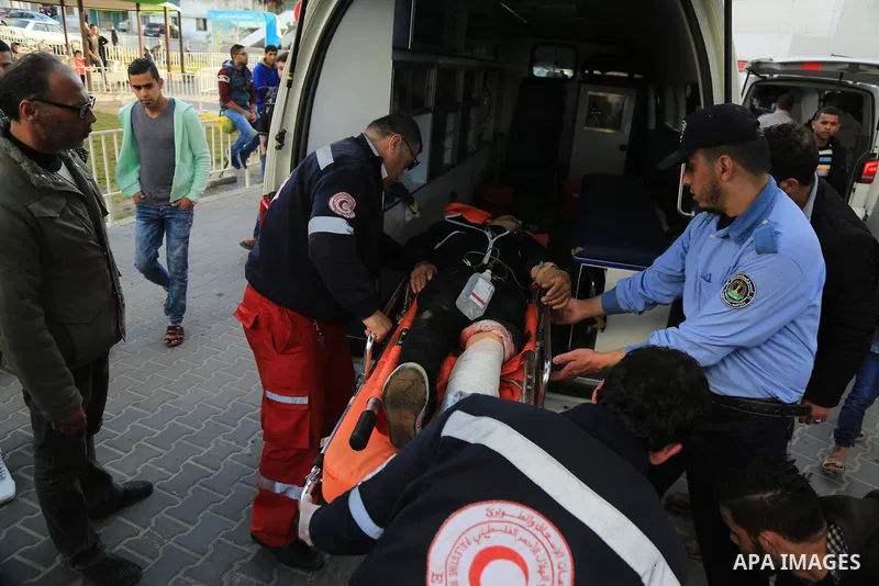 An injured Palestinian protester, who was wounded during clashes with the Israeli army along the Gaza border, recieves treatment at al-Shifa hospital in Gaza City on February 23, 2018. Photo by Dawoud Abo Alkas