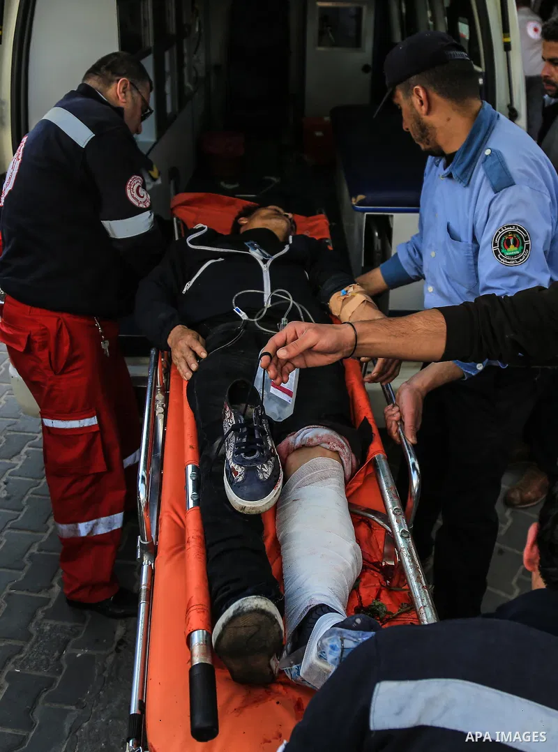 An injured Palestinian protester, who was wounded during clashes with the Israeli army along the Gaza border, recieves treatment at al-Shifa hospital in Gaza City on February 23, 2018. Photo by Dawoud Abo Alkas