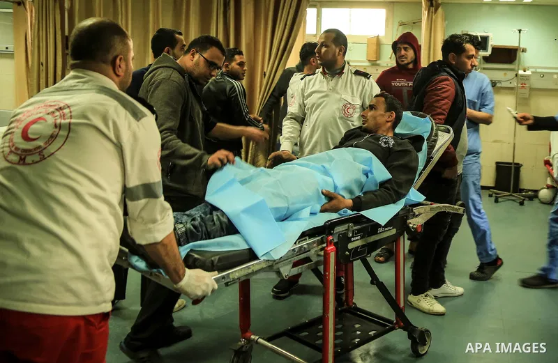 An injured Palestinian protester, who was wounded during clashes with the Israeli army along the Gaza border, recieves treatment at al-Shifa hospital in Gaza City on February 23, 2018. Photo by Dawoud Abo Alkas