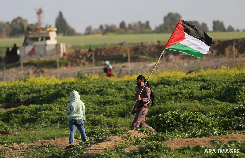 Palestinian protesters clash with Israeli security forces near the border fence with Israel, east of Gaza City on February 23, 2018. Photo by Ashraf Amra