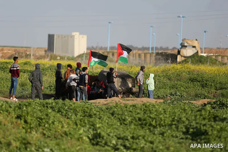 Palestinian protesters clash with Israeli security forces near the border fence with Israel, east of Gaza City on February 23, 2018. Photo by Ashraf Amra