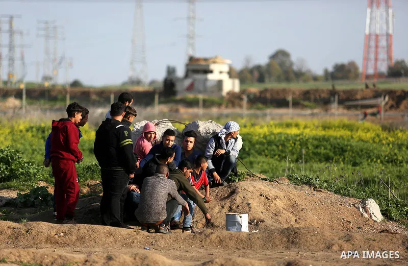 Palestinian protesters clash with Israeli security forces near the border fence with Israel, east of Gaza City on February 23, 2018. Photo by Ashraf Amra
