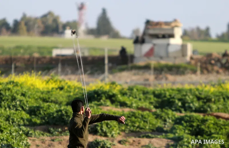 Palestinian protesters clash with Israeli security forces near the border fence with Israel, east of Gaza City on February 23, 2018. Photo by Mohammed Dahman