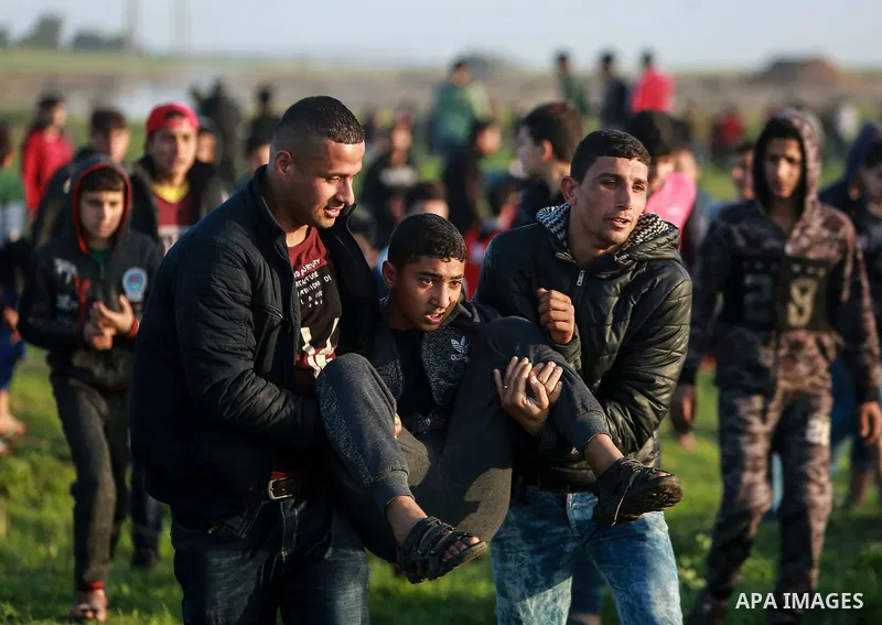 Palestinian protesters clash with Israeli security forces near the border fence with Israel, east of Gaza City on February 23, 2018. Photo by Mohammed Dahman