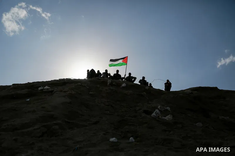 Palestinian protesters clash with Israeli security forces near the border fence with Israel, east of Gaza City on February 23, 2018. Photo by Mohammed Dahman
