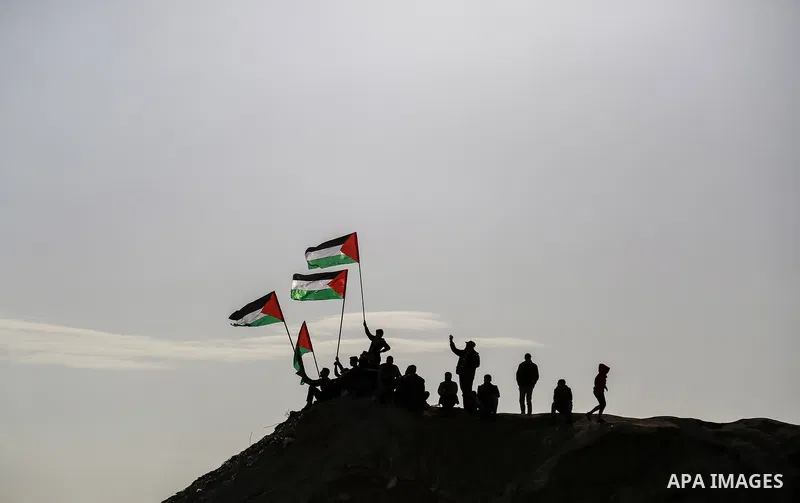 Palestinian protesters clash with Israeli security forces near the border fence with Israel, east of Gaza City on February 23, 2018. Photo by Mohammed Dahman