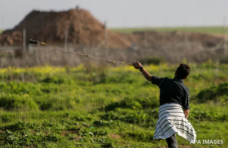 Palestinian protesters clash with Israeli security forces near the border fence with Israel, east of Gaza City on February 23, 2018. Photo by Mohammed Dahman