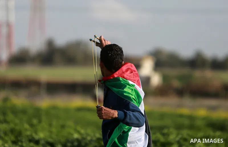 Palestinian protesters clash with Israeli security forces near the border fence with Israel, east of Gaza City on February 23, 2018. Photo by Mohammed Dahman