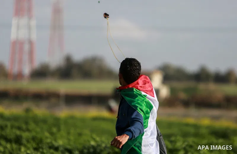 Palestinian protesters clash with Israeli security forces near the border fence with Israel, east of Gaza City on February 23, 2018. Photo by Mohammed Dahman