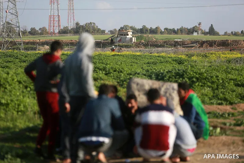Palestinian protesters clash with Israeli security forces near the border fence with Israel, east of Gaza City on February 23, 2018. Photo by Mohammed Dahman