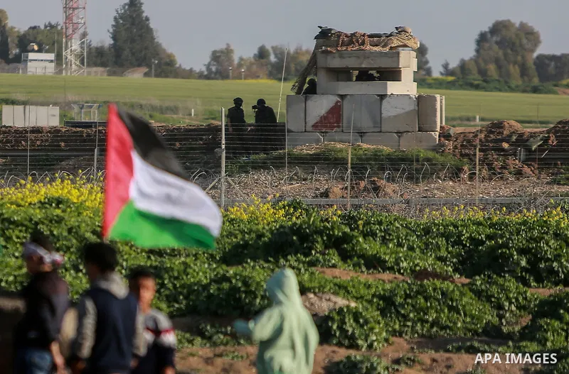 Palestinian protesters clash with Israeli security forces near the border fence with Israel, east of Gaza City on February 23, 2018. Photo by Mohammed Dahman