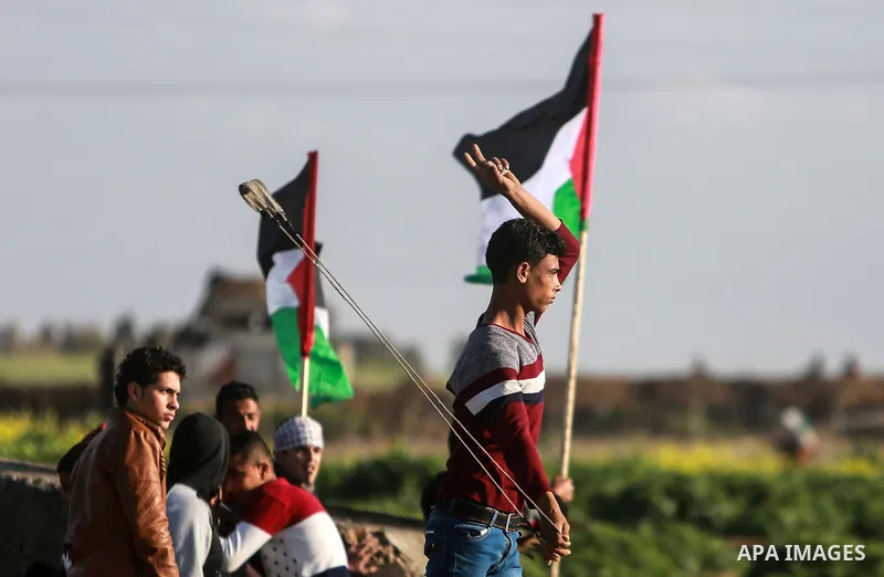 Palestinian protesters clash with Israeli security forces near the border fence with Israel, east of Gaza City on February 23, 2018. Photo by Mohammed Dahman