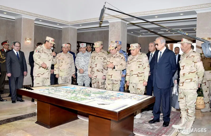 Egyptian President Abdel Fattah al-Sisi dressed in military uniform during his visit to the headquarters of the eastern forces of the Suez Canal at an unknown location in the Sinai on February 25, 2018. Photo by Egyptian...