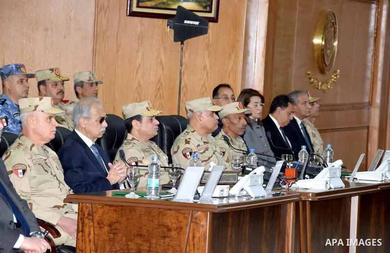 Egyptian President Abdel Fattah al-Sisi dressed in military uniform during his visit to the headquarters of the eastern forces of the Suez Canal at an unknown location in the Sinai on February 25, 2018. Photo by Egyptian...