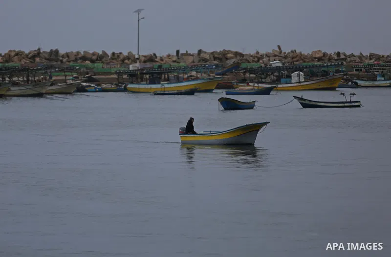Palestinian fishermen work on their fishing boats at the port in Gaza City on February 26, 2018. A spokeswoman for the Israeli army said the boat "deviated from the designated fishing zone in the northern Gaza Strip. "Na...