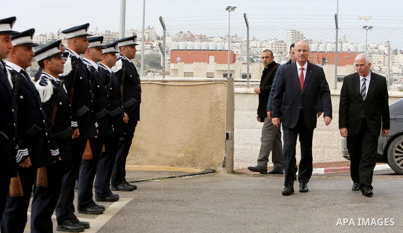 Palestinian Prime Minister Rami Hamdallah meets with Governor of Hebron Kamel Hamid during his visiting on February 26, 2018 in the West Bank city of Hebron. Photo by Prime Minister Office