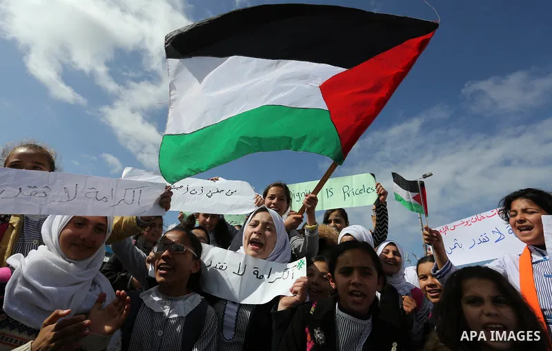 Palestinian students of United Nations-run schools take part in a protest against a U.S. decision to cut aid, in Khan Younis in the southern Gaza Strip February 27, 2018. Photo by Ashraf Amra