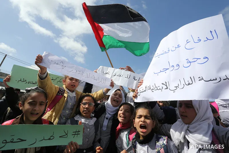 Palestinian students of United Nations-run schools take part in a protest against a U.S. decision to cut aid, in Khan Younis in the southern Gaza Strip February 27, 2018. Photo by Ashraf Amra
