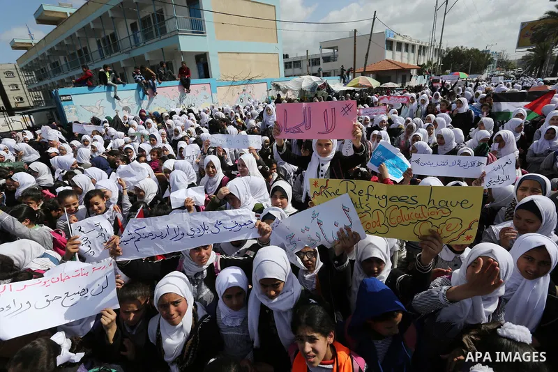 Palestinian students of United Nations-run schools take part in a protest against a U.S. decision to cut aid, in Khan Younis in the southern Gaza Strip February 27, 2018. Photo by Ashraf Amra