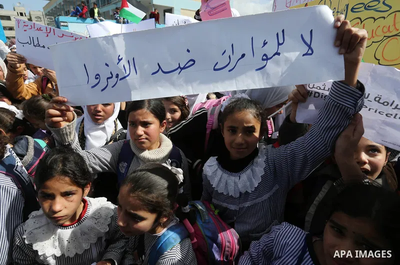Palestinian students of United Nations-run schools take part in a protest against a U.S. decision to cut aid, in Khan Younis in the southern Gaza Strip February 27, 2018. Photo by Ashraf Amra