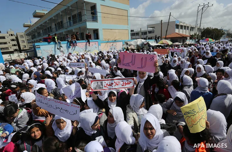 Palestinian students of United Nations-run schools take part in a protest against a U.S. decision to cut aid, in Khan Younis in the southern Gaza Strip February 27, 2018. Photo by Ashraf Amra