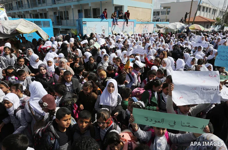 Palestinian students of United Nations-run schools take part in a protest against a U.S. decision to cut aid, in Khan Younis in the southern Gaza Strip February 27, 2018. Photo by Ashraf Amra
