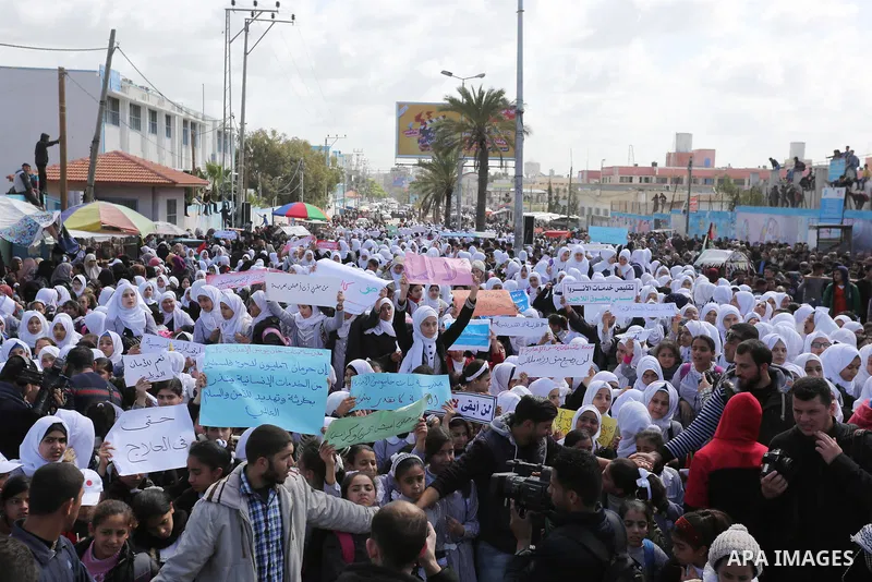 Palestinian students of United Nations-run schools take part in a protest against a U.S. decision to cut aid, in Khan Younis in the southern Gaza Strip February 27, 2018. Photo by Ashraf Amra