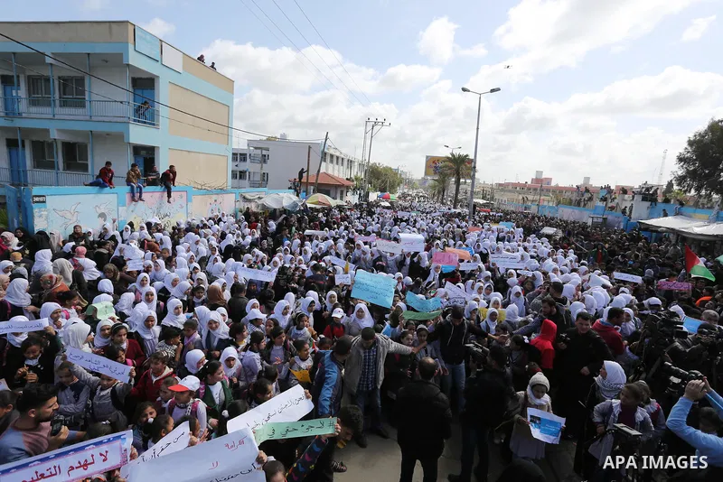 Palestinian students of United Nations-run schools take part in a protest against a U.S. decision to cut aid, in Khan Younis in the southern Gaza Strip February 27, 2018. Photo by Ashraf Amra