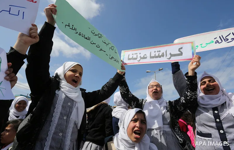 Palestinian students of United Nations-run schools take part in a protest against a U.S. decision to cut aid, in Khan Younis in the southern Gaza Strip February 27, 2018. Photo by Ashraf Amra