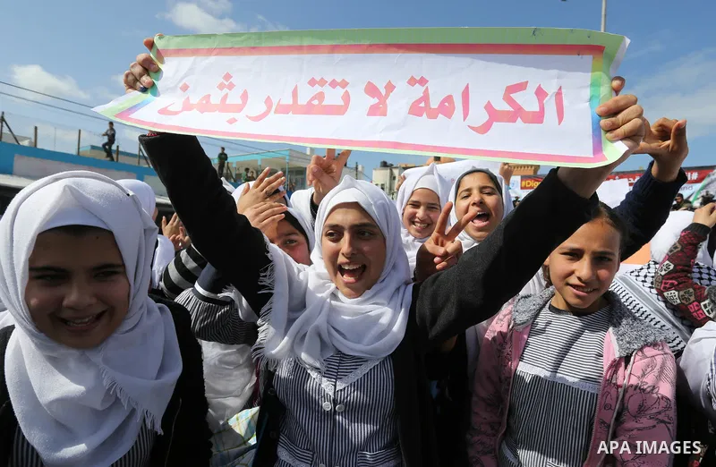 Palestinian students of United Nations-run schools take part in a protest against a U.S. decision to cut aid, in Khan Younis in the southern Gaza Strip February 27, 2018. Photo by Ashraf Amra
