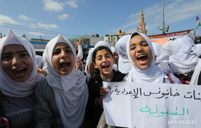 Palestinian students of United Nations-run schools take part in a protest against a U.S. decision to cut aid, in Khan Younis in the southern Gaza Strip February 27, 2018. Photo by Ashraf Amra