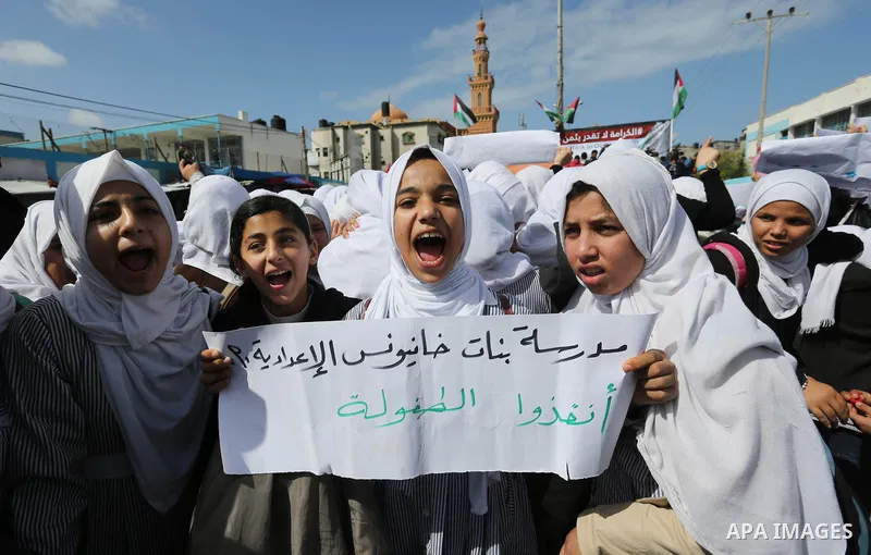 Palestinian students of United Nations-run schools take part in a protest against a U.S. decision to cut aid, in Khan Younis in the southern Gaza Strip February 27, 2018. Photo by Ashraf Amra