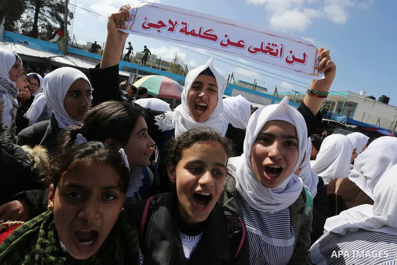 Palestinian students of United Nations-run schools take part in a protest against a U.S. decision to cut aid, in Khan Younis in the southern Gaza Strip February 27, 2018. Photo by Ashraf Amra