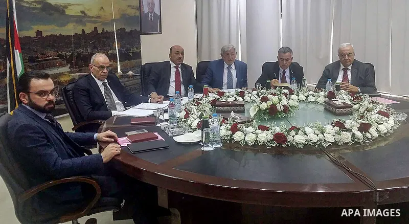Palestinian Ministers in Gaza strip attend meeting of ministers held in the West bank city of Ramallah via video conference, on February 27, 2018. Photo by Prime Minister Office