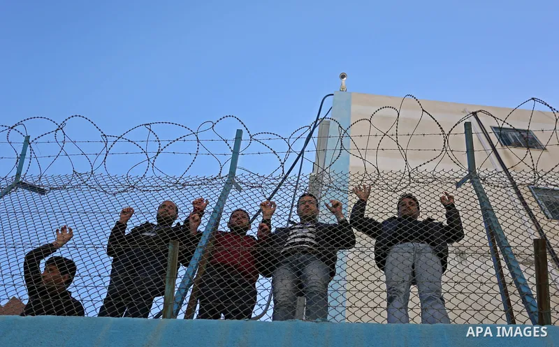Palestinians take part in a protest against a U.S. decision to cut aid, in front of the headquarters United Nations Relief and Works Agency (UNRWA) in Gaza city on February 28, 2018. Photo by Ashraf Amra