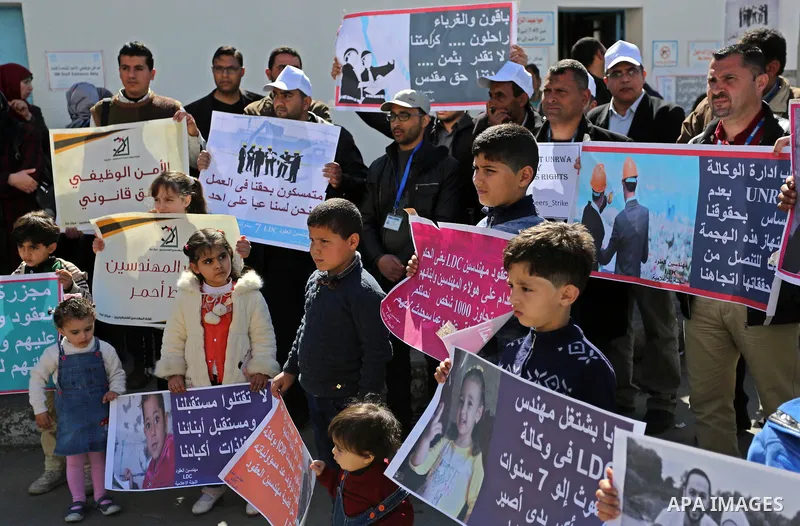 Palestinians take part in a protest against a U.S. decision to cut aid, in front of the headquarters United Nations Relief and Works Agency (UNRWA) in Gaza city on February 28, 2018. Photo by Ashraf Amra