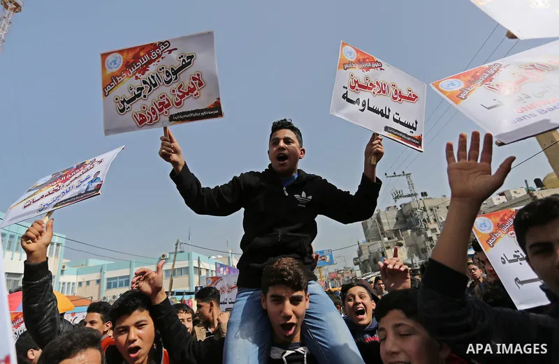 Palestinians take part in a protest against a U.S. decision to cut aid, in Jabalia in the northern Gaza Strip on March 1, 2018. Photo by Ashraf Amra