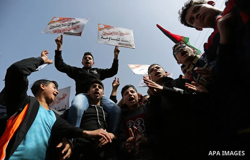 Palestinians take part in a protest against a U.S. decision to cut aid, in Jabalia in the northern Gaza Strip on March 1, 2018. Photo by Ashraf Amra