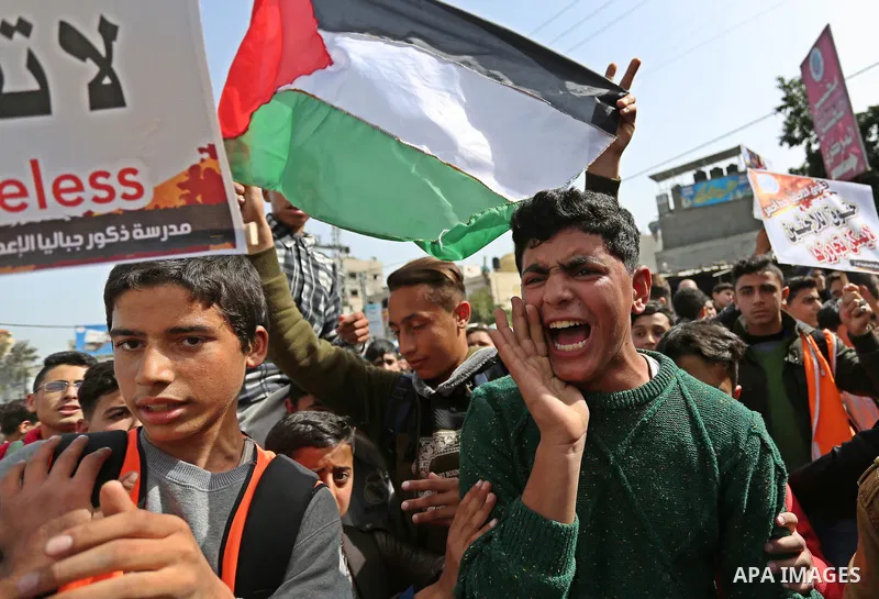 Palestinians take part in a protest against a U.S. decision to cut aid, in Jabalia in the northern Gaza Strip on March 1, 2018. Photo by Ashraf Amra