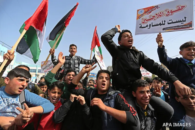 Palestinians take part in a protest against a U.S. decision to cut aid, in Jabalia in the northern Gaza Strip on March 1, 2018. Photo by Ashraf Amra