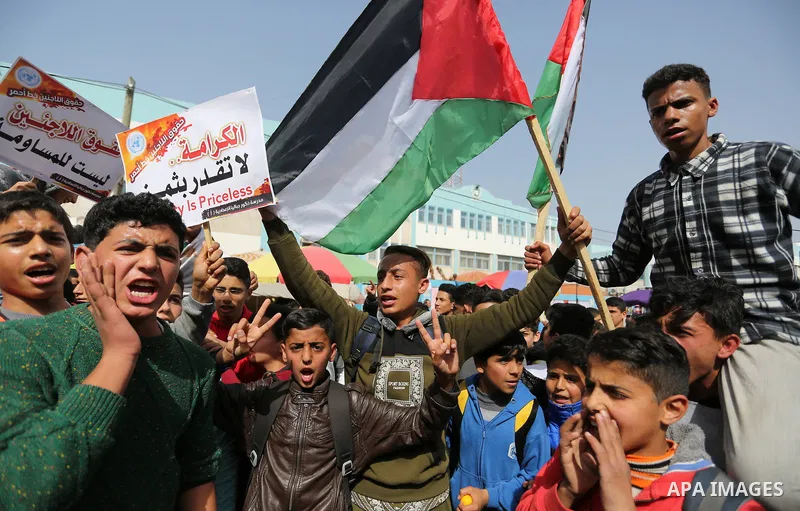 Palestinians take part in a protest against a U.S. decision to cut aid, in Jabalia in the northern Gaza Strip on March 1, 2018. Photo by Ashraf Amra