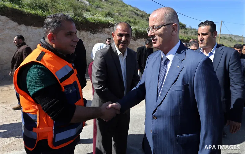 Palestinian Prime Minister Rami Hamdallah inspects the progress of the rehabilitation project of the main street west of Anabta, near the West Bank city of Tulkarm on March 3, 2018. Photo by Prime Minister Office