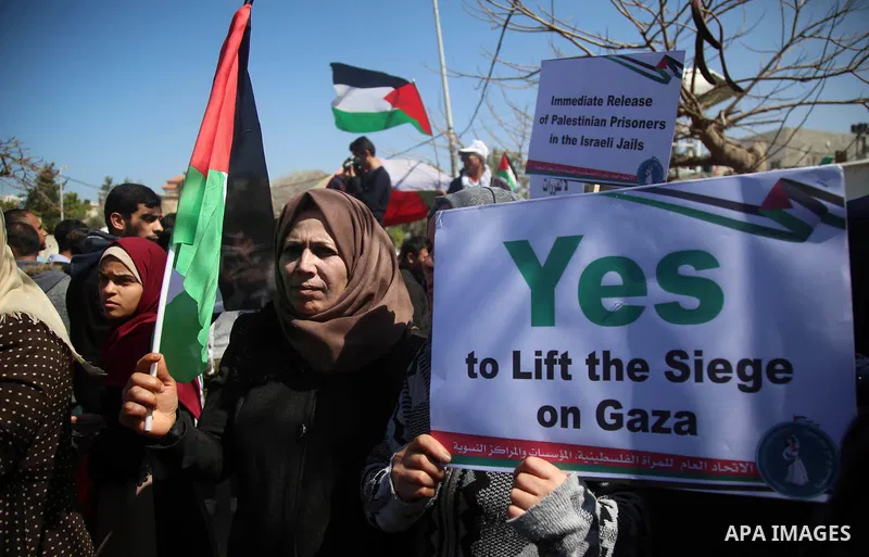 Palestinian women take part in a rally on the occasion of International Women's Day, in Gaza city, on March 7, 2018. Photo by Hassan Jedi