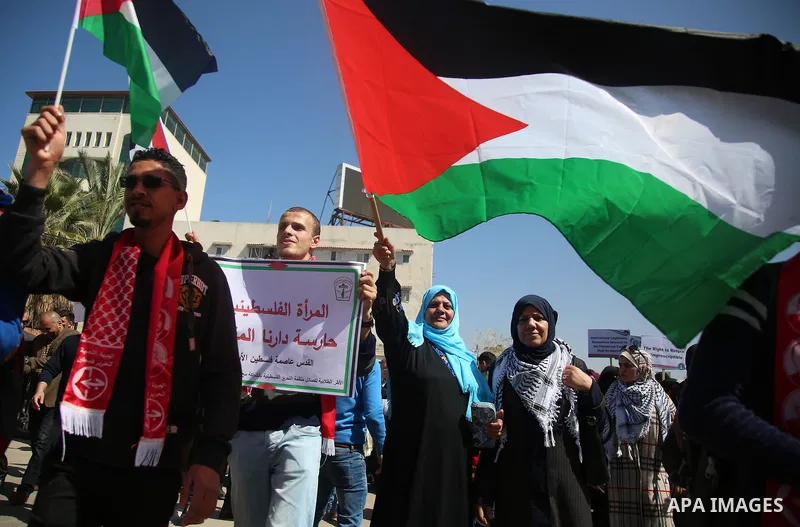 Palestinian women take part in a rally on the occasion of International Women's Day, in Gaza city, on March 7, 2018. Photo by Hassan Jedi