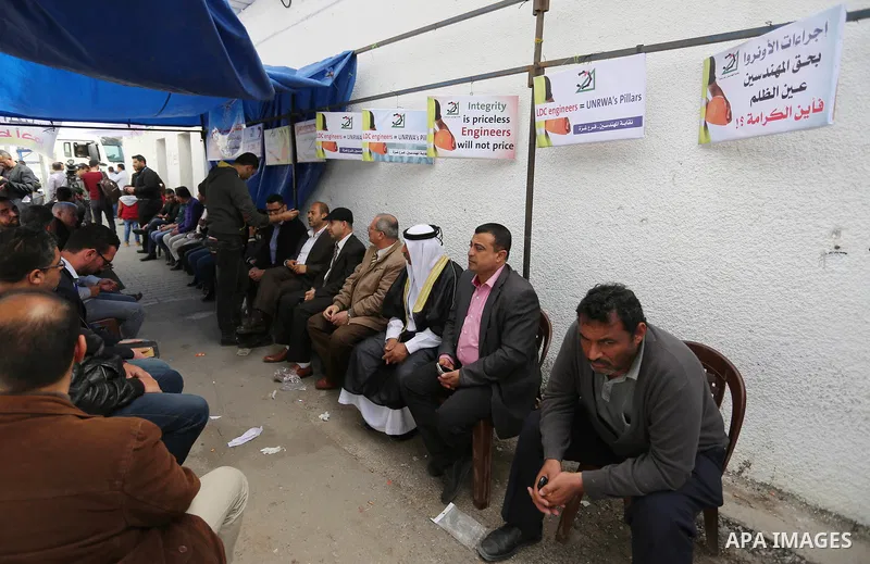 Palestinian engineers take part in a protest tent against the UNRWA decision to reduce of the work contracts in front of the headquarters United Nations Relief and Works Agency (UNRWA) in Gaza city, March 8, 2018. Photo...