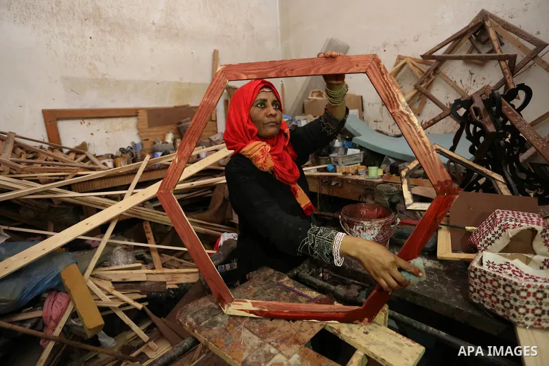 Amel Abu Rgayeg, a 40 years old Palestinian refugee carpenter, works in her small carpentry workshop, at al-Nusairat refugee camp in the central Gaza Strip, 08 March 2018. Amel was married to a man from the Arab citizens...