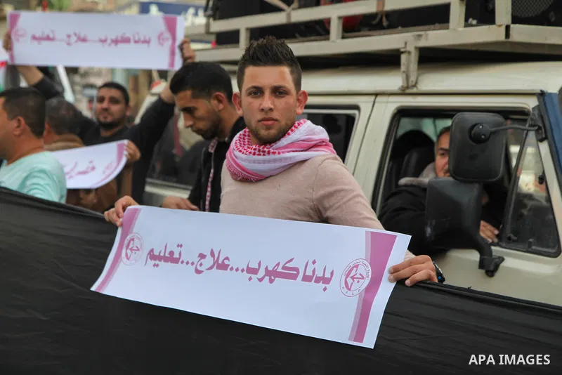 Palestinians participate in a demonstration to support the palestinian reconciliation efforts between Fatah and Hamas, and demand better living conditions, in Jabalia in the northern Gaza Strip on February 01, 2018. Phot...