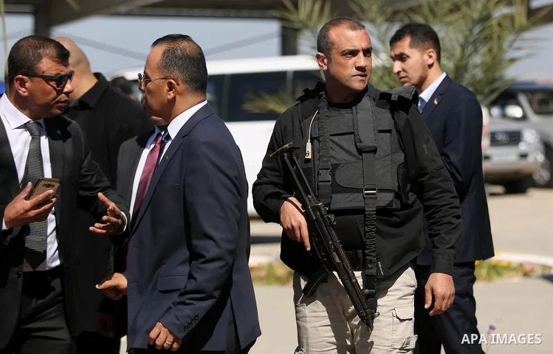 bodyguards of the Palestinian Prime Minister escort the PM's convoy, in the northern Gaza Strip March 13, 2018. Hamdallah cut short a rare visit to Gaza on Tuesday after an explosion targeted his convoy, a source in the...