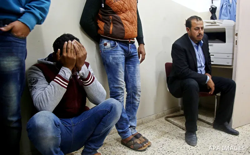 Relatives of a Palestinian fisherman Ismail Abu Riala, 18, who was shot dead by Israeli Naval forces on February 14, mourn at al-Shifa hospital after Israeli High Court decided to release his body, in Gaza City on March...