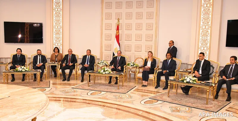 A handout picture released by the Egyptian Presidency on March 15, 2018 shows Egyptian President Abdel Fattah al-Sisi Receives a delegation from the official trophy tours the globe ahead of the 2018 FIFA World Cup tourna...